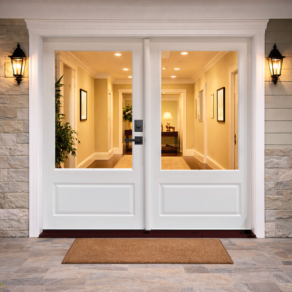 A pair of white 3/4-lite hinged patio doors in a bright room, opening onto a garden